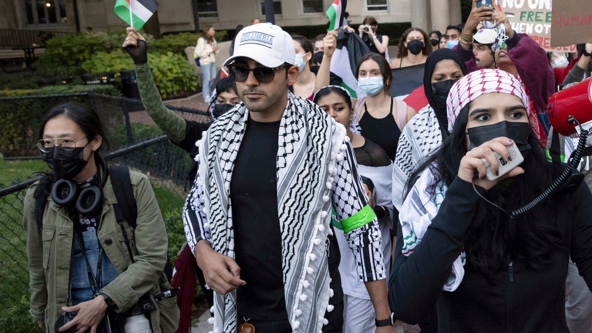 Mohsen Mahdawi, center, looks on during an anti-Israel protest at Columbia University on Oct. 12, 2023, in New York.