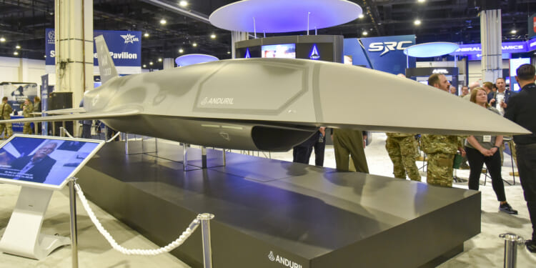 The Air Force Research Laboratory showcases Collaborative Combat Aircraft in its booth during the Air, Space and Cyber Conference at the Gaylord National Resort and Convention Center in National Harbor, Maryland, Sept. 18, 2024.