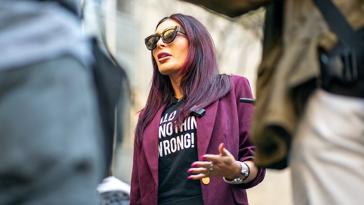 Laura Loomer wearing sunglasses