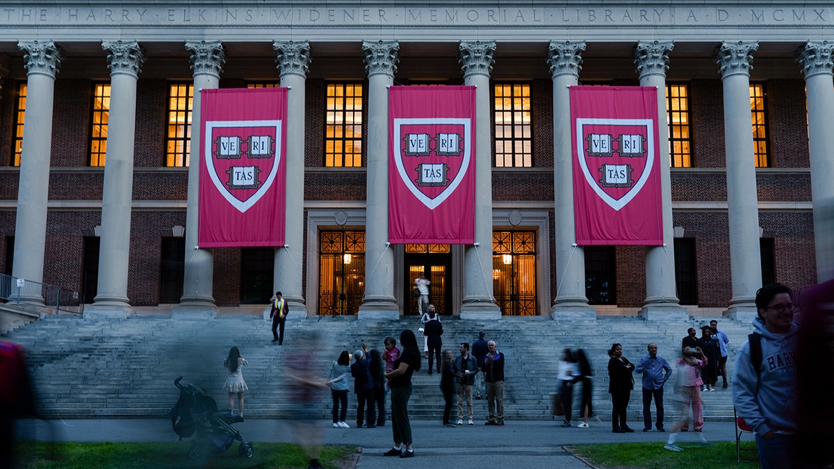 Harvard University banners hang from building