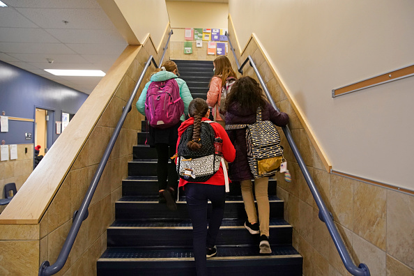 Students arrive for school at Freedom Preparatory Academy in Provo, Utah. 
