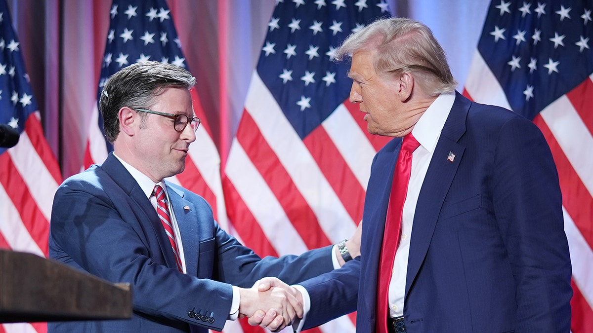 House Speaker Mike Johnson and President Donald Trump handshake
