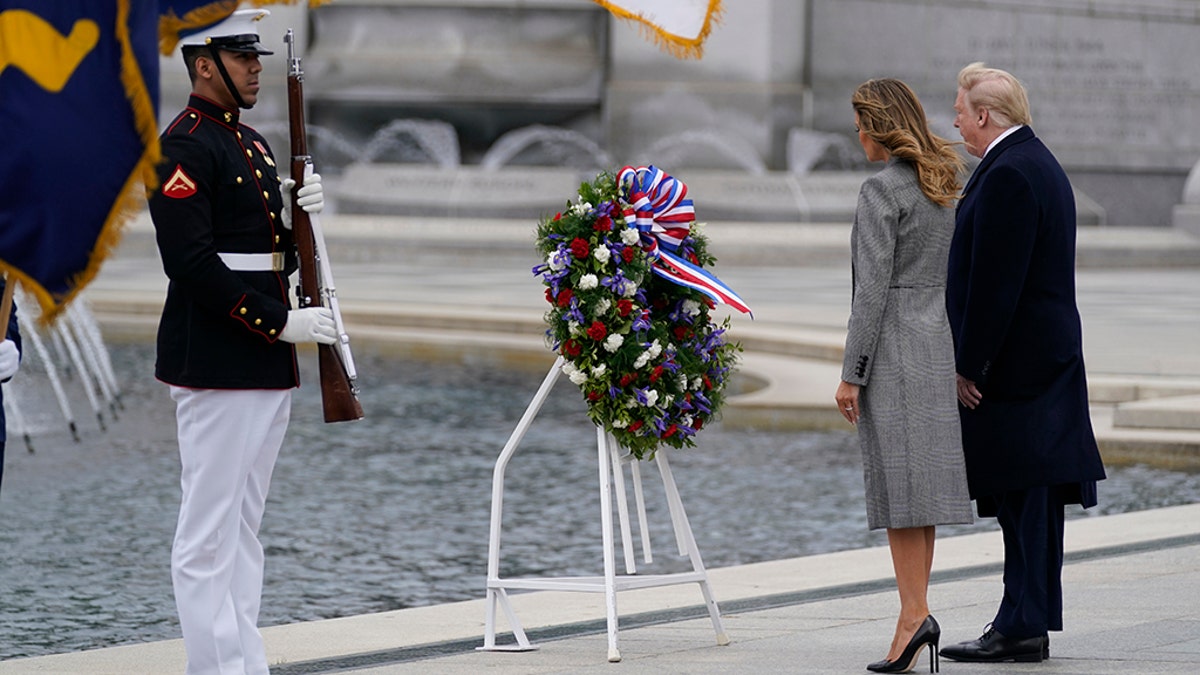 FILE: President Donald Trump and first lady Melania Trump participate in a wreath-laying ceremony at the World War II Memorial in Washington, D.C., to commemorate the 75th anniversary of Victory in Europe Day on May 8, 2020.