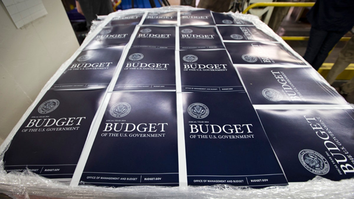 Copies of President Obama's proposed federal budget plan for fiscal year 2014 are prepared for delivery at the U.S. Government Printing Office.