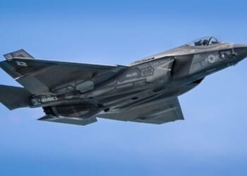 A sleek F-35 fighter jet soars through the sky, showcasing cutting-edge stealth technology and advanced aerodynamics. Perfect for aviation enthusiasts and modern military aviation decor.