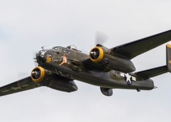 A B-25 Mitchell bomber aircraft in flight.