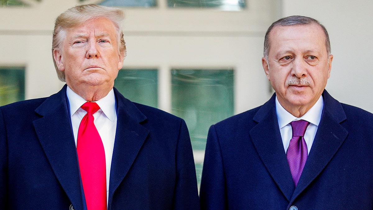 President Donald Trump stands with Turkey's President Recep Tayyip Erdogan