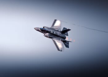 US F-35 fighter jet flying in sky