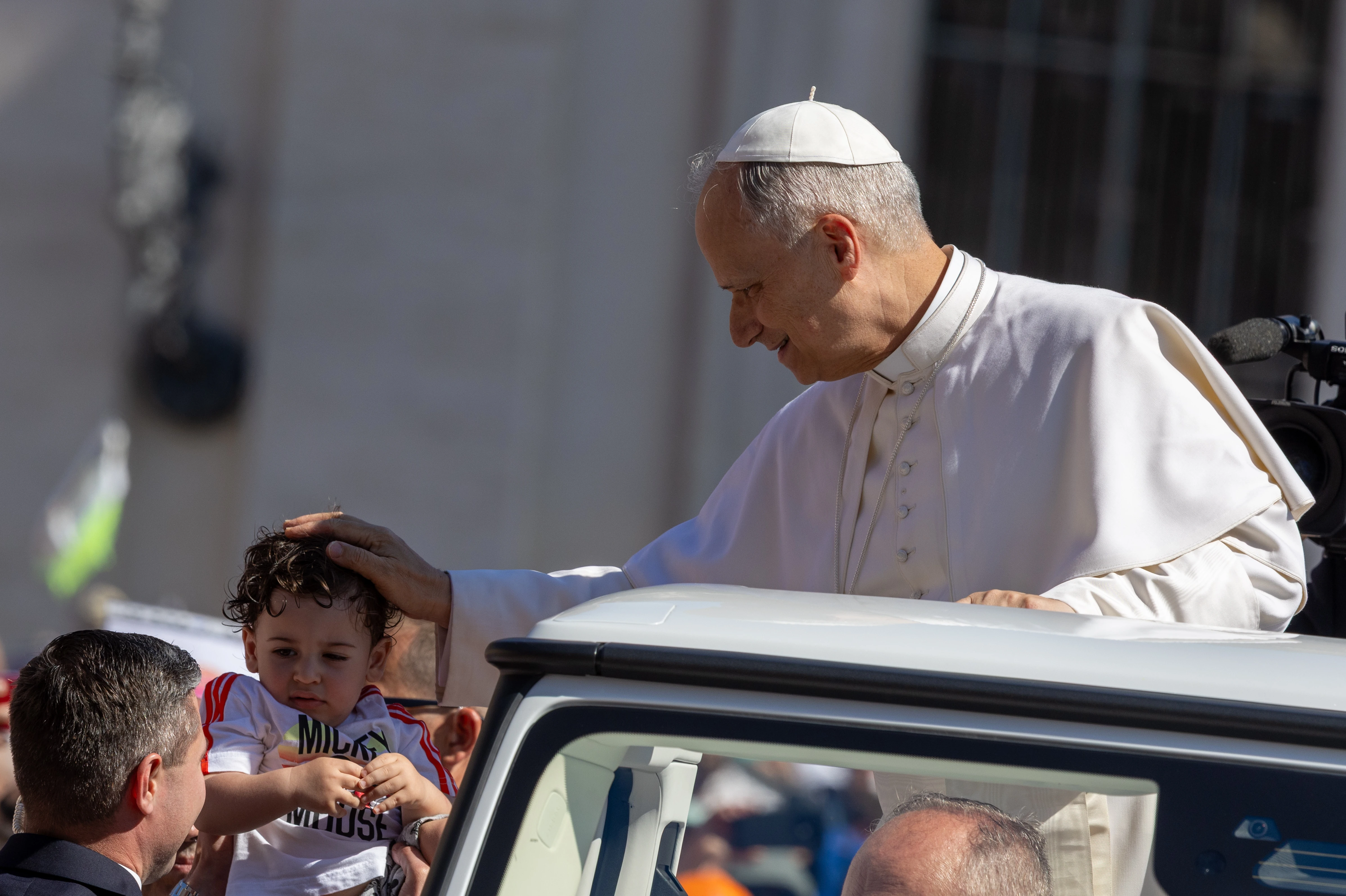 Pope Leo XIV blesses a child from his popemobile on St. Peter's Square on Sunday, June 1, 2025. Credit: Daniel Ibáñez/CNA
