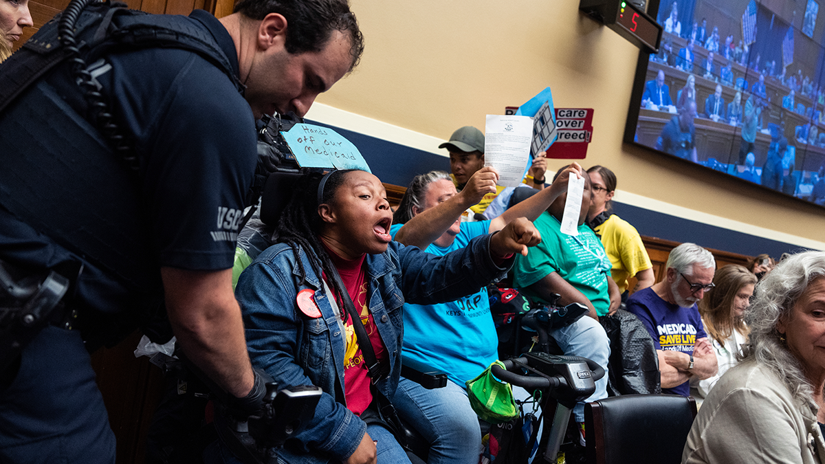 Demonstrators calling for preservation of Medicaid funding, are removed from the House Energy and Commerce markup of the FY2025 budget resolution in Rayburn building on Tuesday, May 13, 2025.
