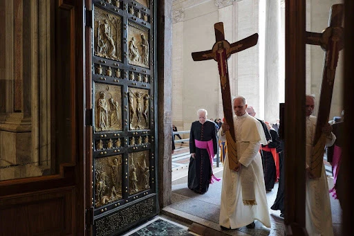 Pope Leo XIV passes through the Holy Door carrying the jubilee cross as he leads the pilgrimage of the Holy See on June 9, 2025. Credit: Vatican Media