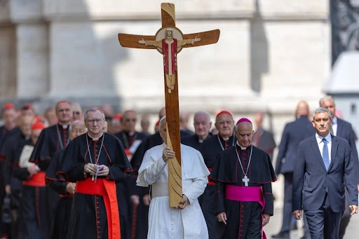 Pope Leo XIV carries the jubilee cross as he leads a pilgrimage of cardinals, bishops, and employees of the Roman Curia through the Holy Door on June 9, 2025. Credit: Daniel Ibanez/CNA