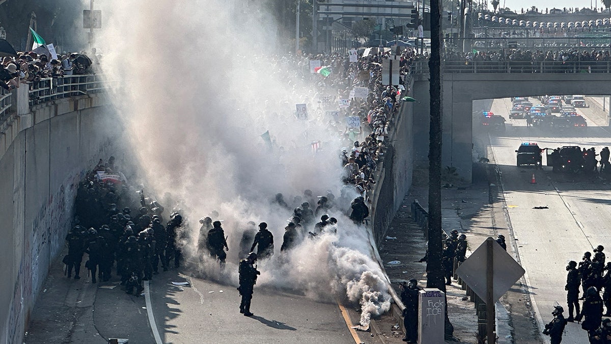 LA riot with cloud of tear gas