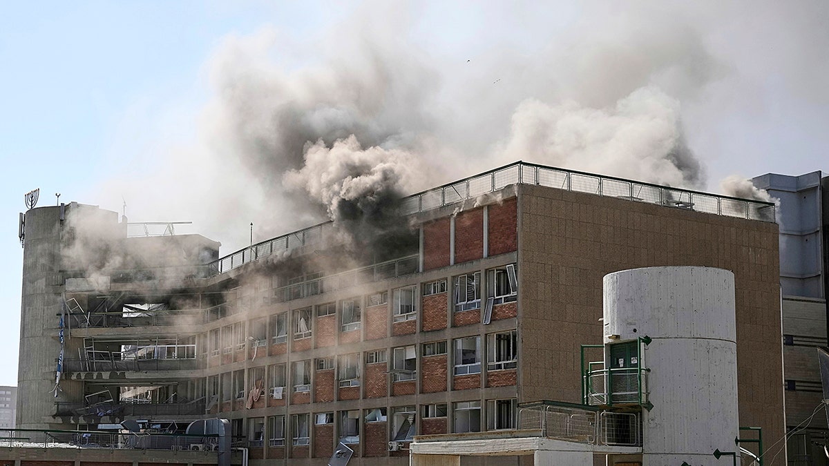 Smoke rises from a building of the Soroka hospital complex after it was hit by a missile fired from Iran in Be'er Sheva, Israel, Thursday, Jun. 19, 2025.