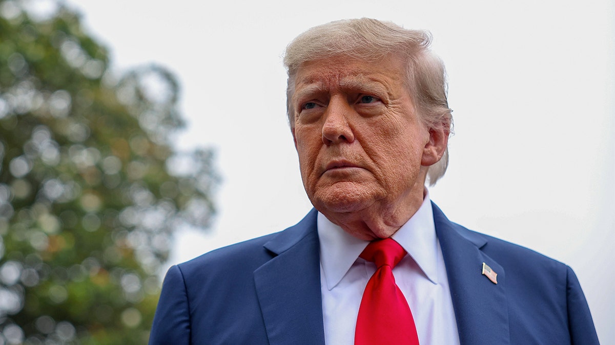 President Donald Trump stops and talks to the media before he boards Marine One following Israel launching strikes on Iran in June.
