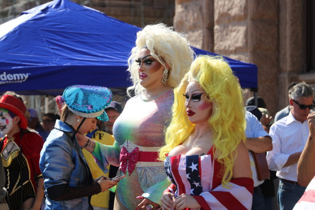 Drag Queens Surround Democrat Congressman Doggett as he speaks to crowd (Randy Clark/Breitbart Texas)
