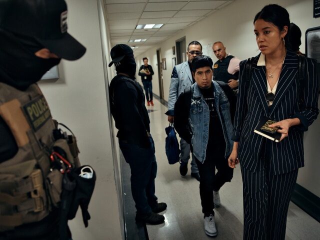ICE Detains Immigrants Inside New York City Courthouses NEW YORK, NEW YORK - JUNE 11: Federal agents prepare to approach and detain a person, cent