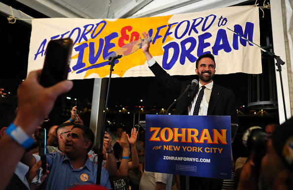 Zohran Mamdani greets supporters during an election night gathering