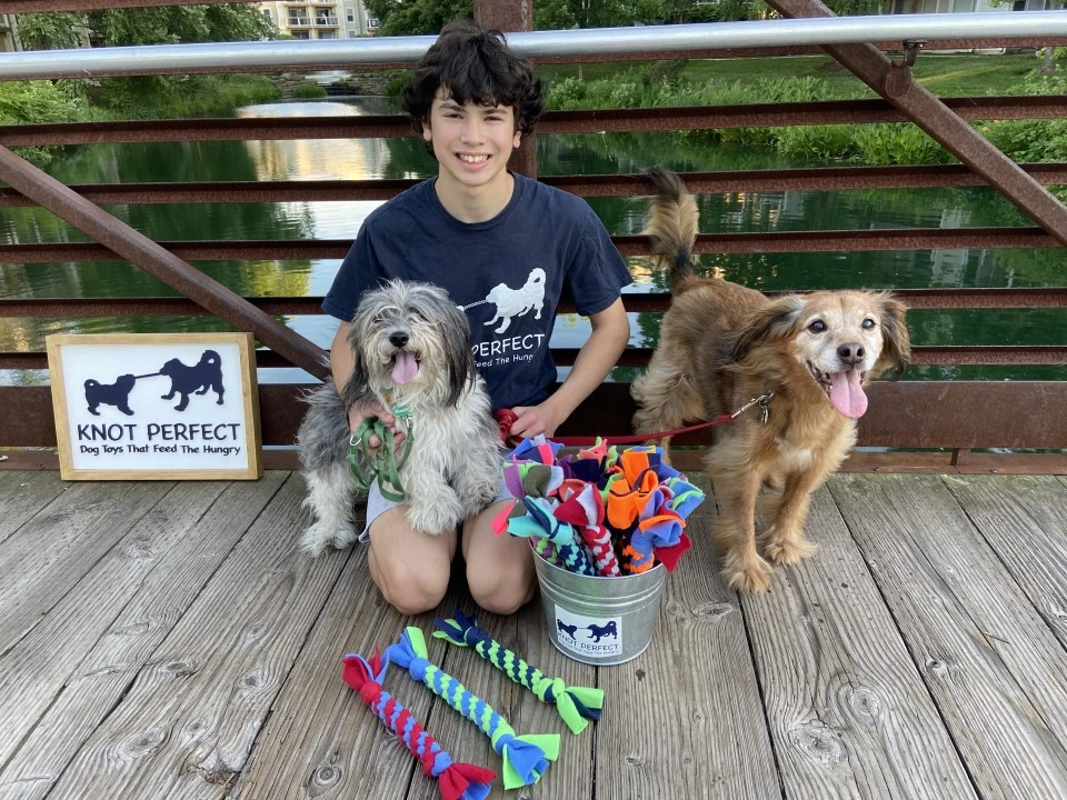 Austin Baron pictured with the handmade knotted dog toys given to people who have donated to Knot Perfect. Credit: Photo courtesy of Austin Baron