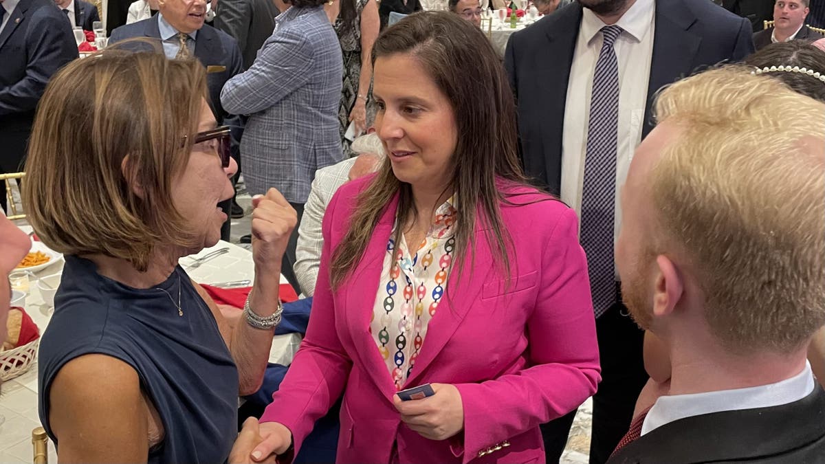 GOP Rep. Elise Stefanik of New York speaks with an attendee at a Staten Island GOP fundraising dinner, on June 2, 2025 in New York City.