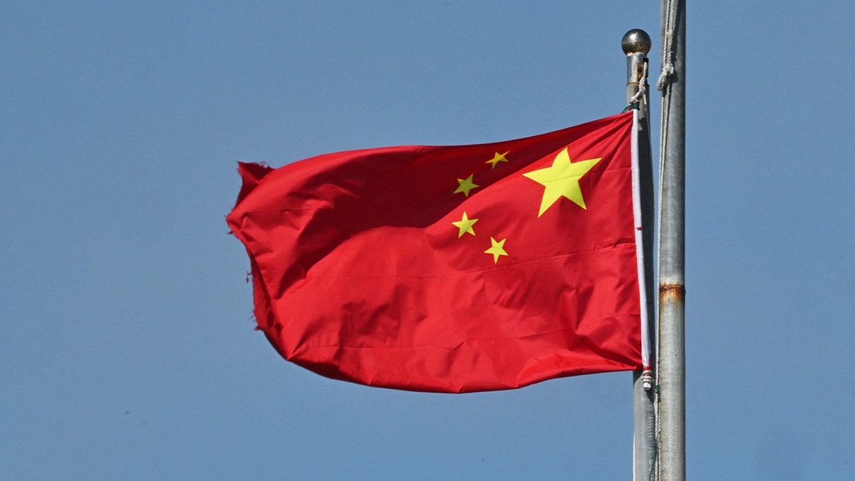 China's national flag flutters on Pingtan island, the closest point in China to Taiwan's main island, in southeast China's Fujian province on December 11, 2024