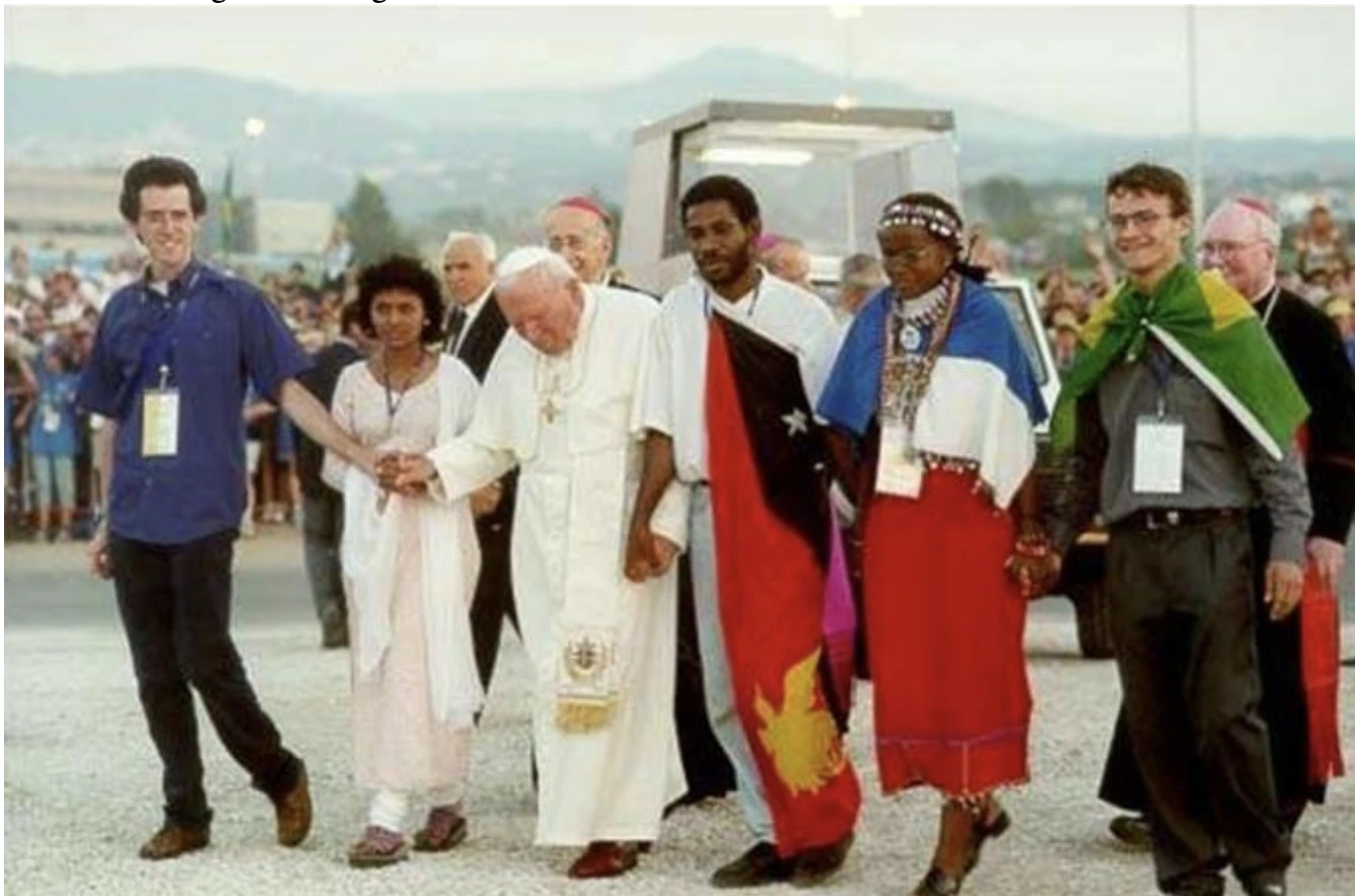 John Paul II's arrival at Tor Vergata, symbolically holding the hand of a young person from each continent. Credit: Vatican Media
