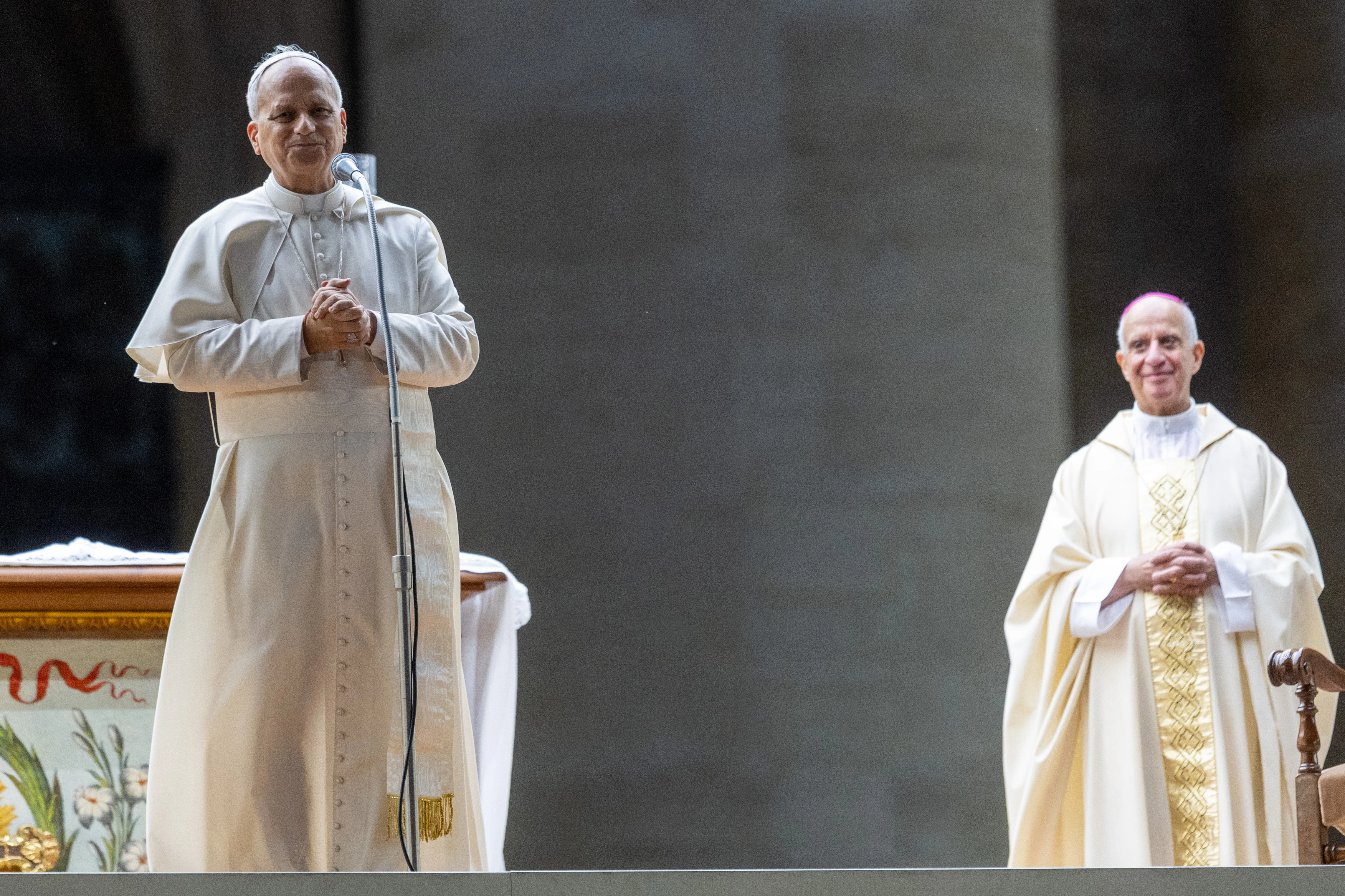 Pope Leo XIV addresses the crowd following his unexpected ride around St. Peter’s Square at the Vatican following the Jubilee of Youth welcome Mass — which was celebrated by Archbishop Rino Fisichella (right) — on July 29, 2025. Credit: Daniel Ibañez/CNA