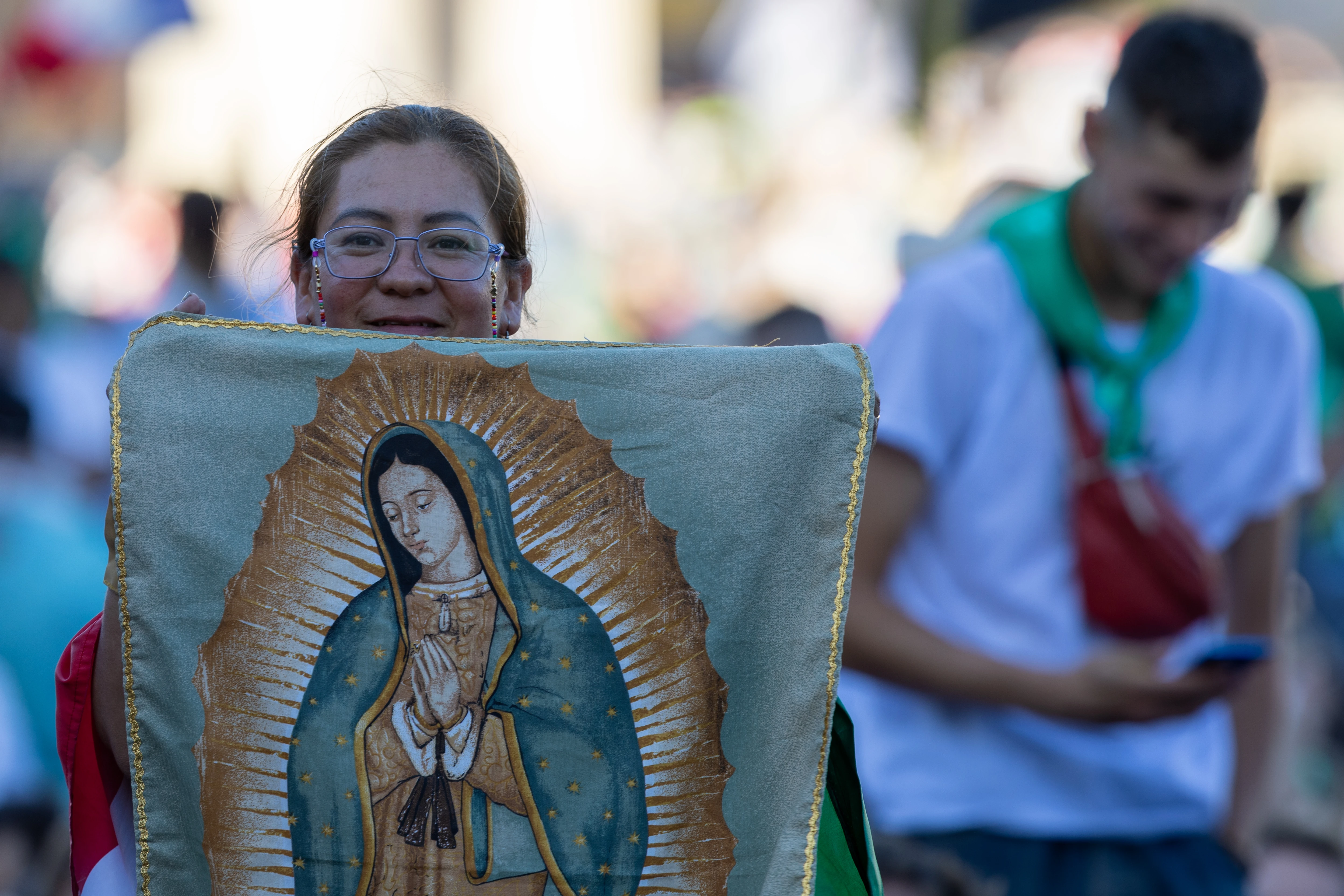 A young woman holds an image of Our Lady of Guadalupe during the Jubilee of Youth welcome Mass on July 29, 2025, in St. Peter’s Square at the Vatican. Credit: Daniel Ibañez/CNA