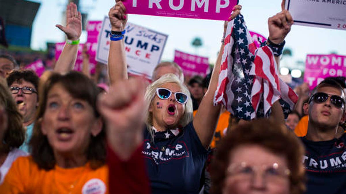 Supporters of Republican presidential candidate Donald Trump cheer during a campaign rally, Monday, Oct. 24, 2016, in Tampa, Fla. (AP Photo/ Evan Vucci)
