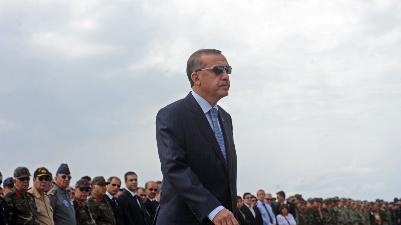President Turkey rises to address assembled soldiers.