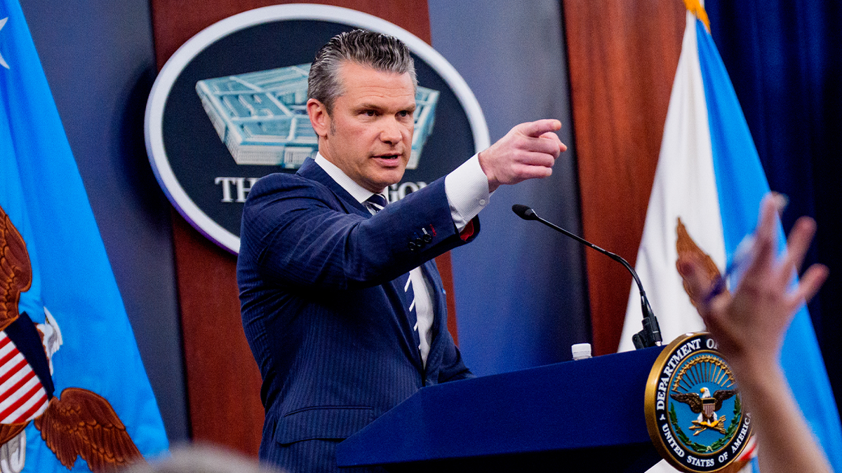 .S. Defense Secretary Pete Hegseth (L), accompanied by Chairman of the Joint Chiefs of Staff Air Force Gen. Dan Caine (R), takes a question from a reporter during a news conference at the Pentagon on June 22, 2025 in Arlington, Virginia. 