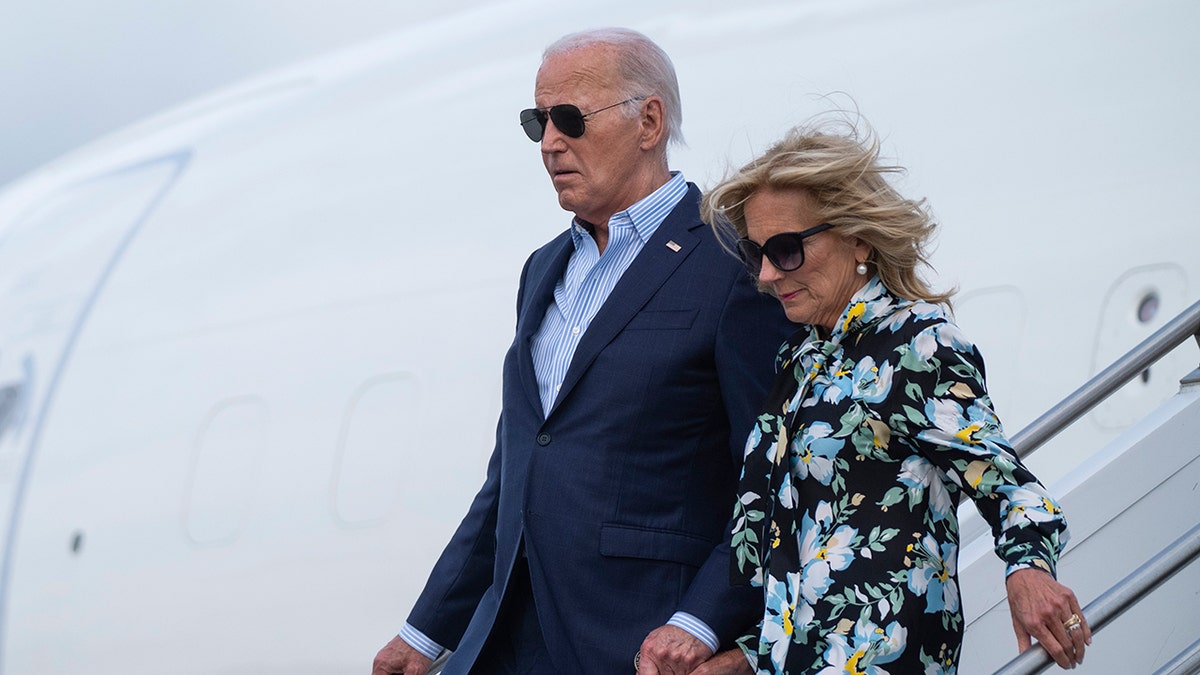 Joe and Jill Biden walking out of airplane
