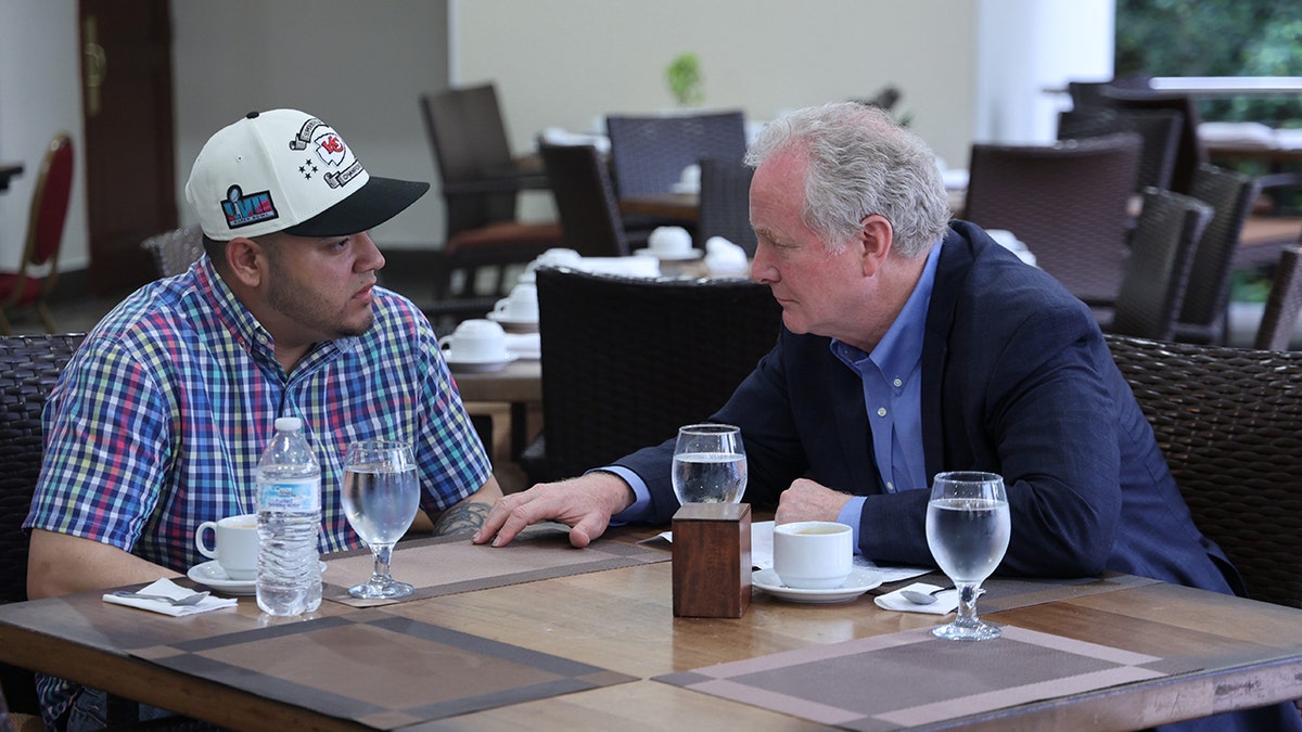 Abrego Garcia at table with Sen. Van Hollen