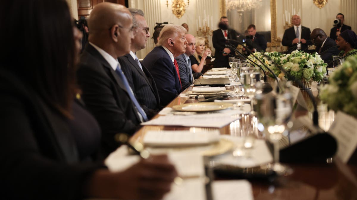 President Donald Trump listens during a multilateral lunch with African leaders in the State Dining Room of the White House on July 9, 2025.