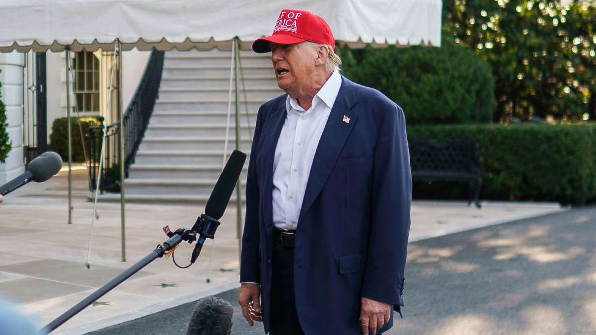 President Trump talks to reporters outside the White House on July 1, 2025.