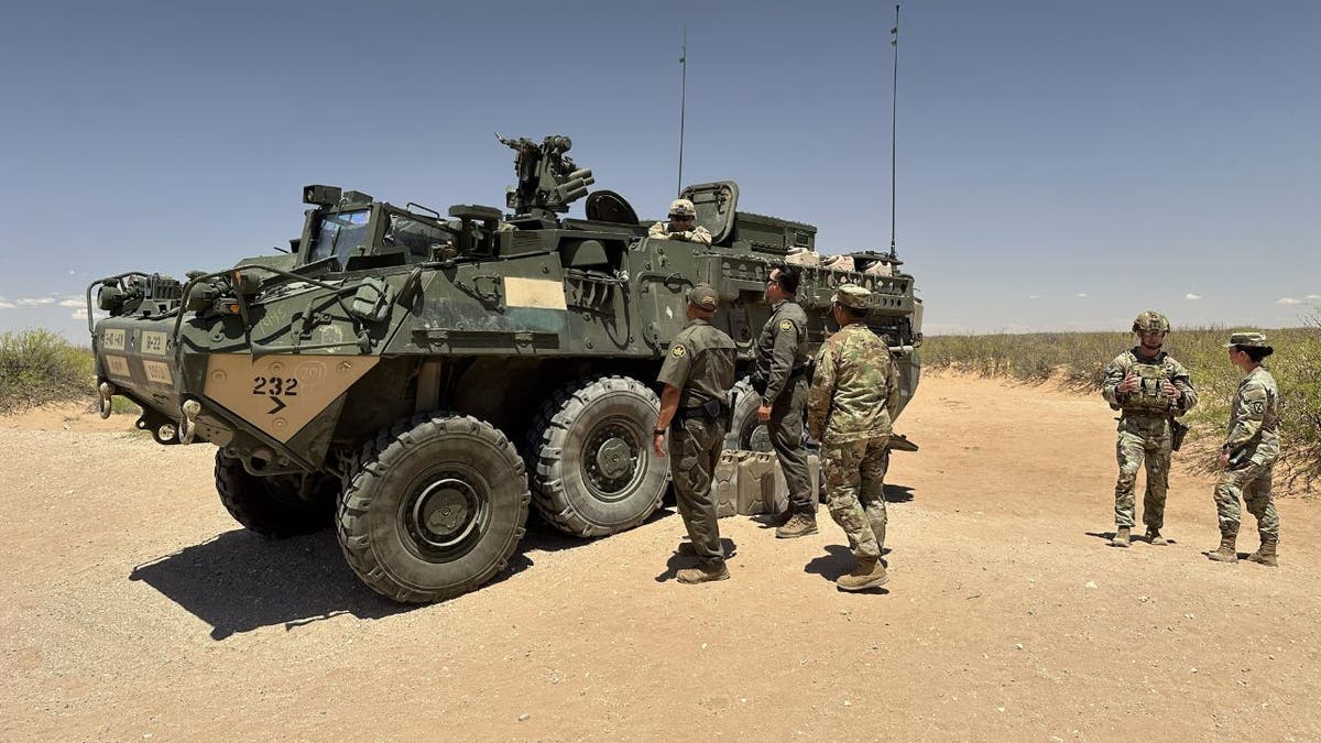 US soldiers at Mexican border with armored personnel carrier