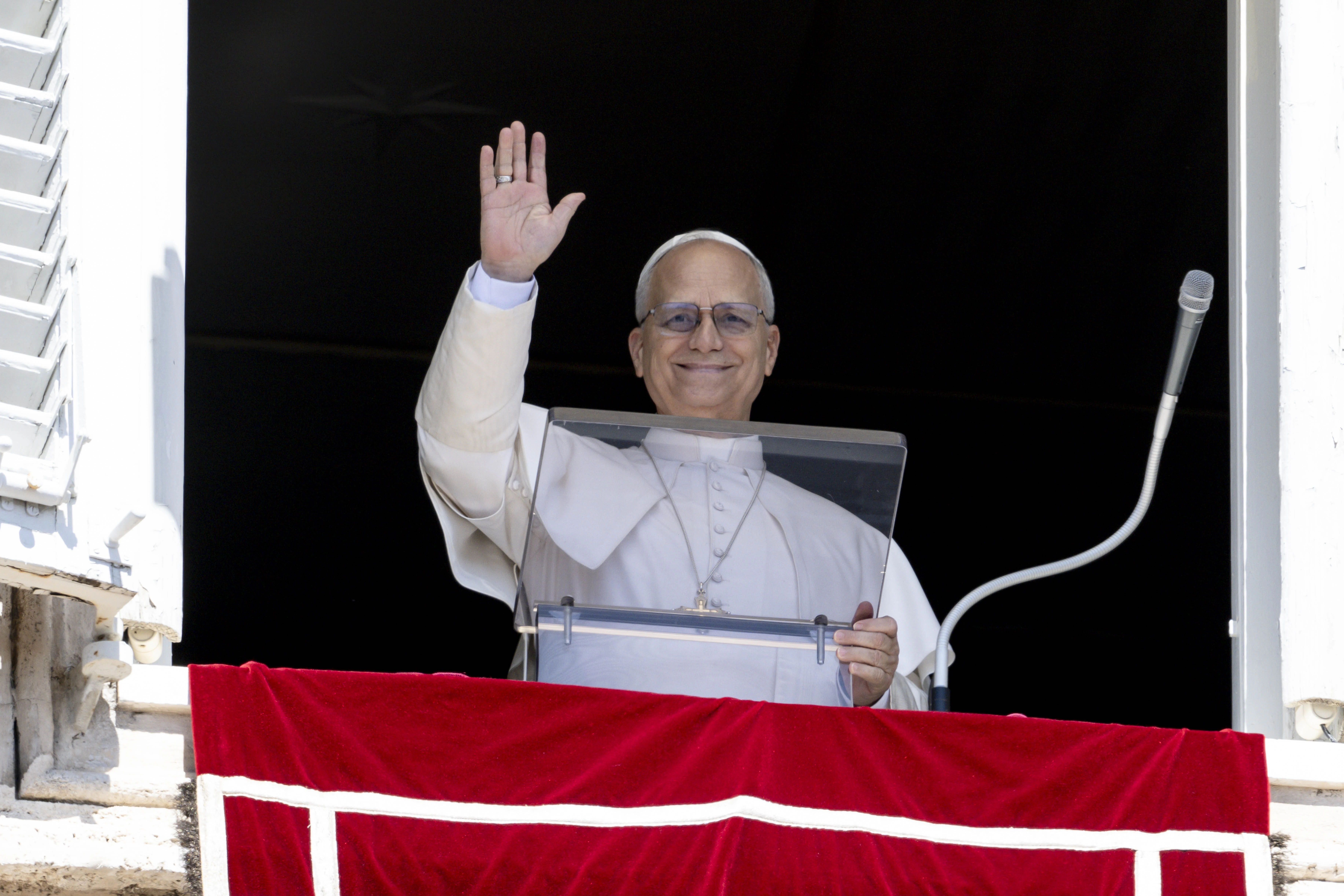 Pope Leo XIV waves to the large crowds in a sunny St. Peter's Square after delivering a message and leading the Angelus prayer on Aug. 31, 2025. Credit: Vatican Media.
