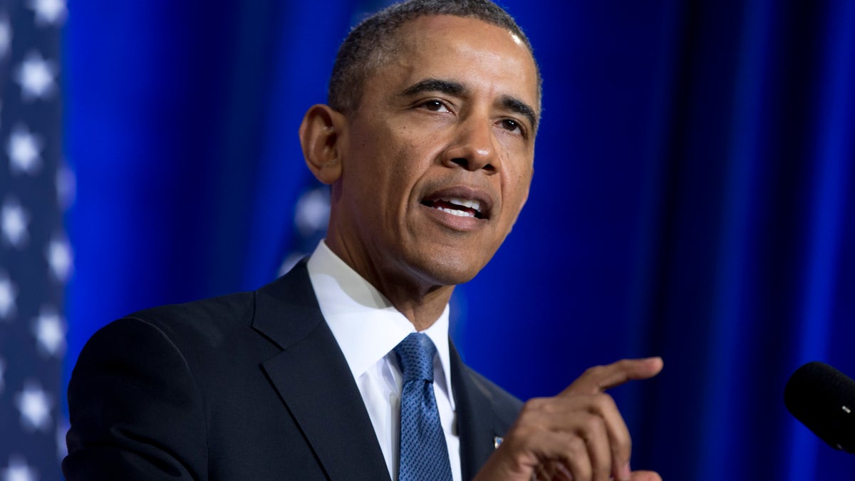 President Barack Obama talks about National Security Agency (NSA) surveillance, Friday, Jan. 17, 2014, at the Justice Department in Washington.Seeking to calm a furor over U.S. surveillance, the president called for ending the government's control of phone data from hundreds of millions of Americans and immediately ordered intelligence agencies to get a secretive court's permission before accessing the records. (AP Photo/Carolyn Kaster)