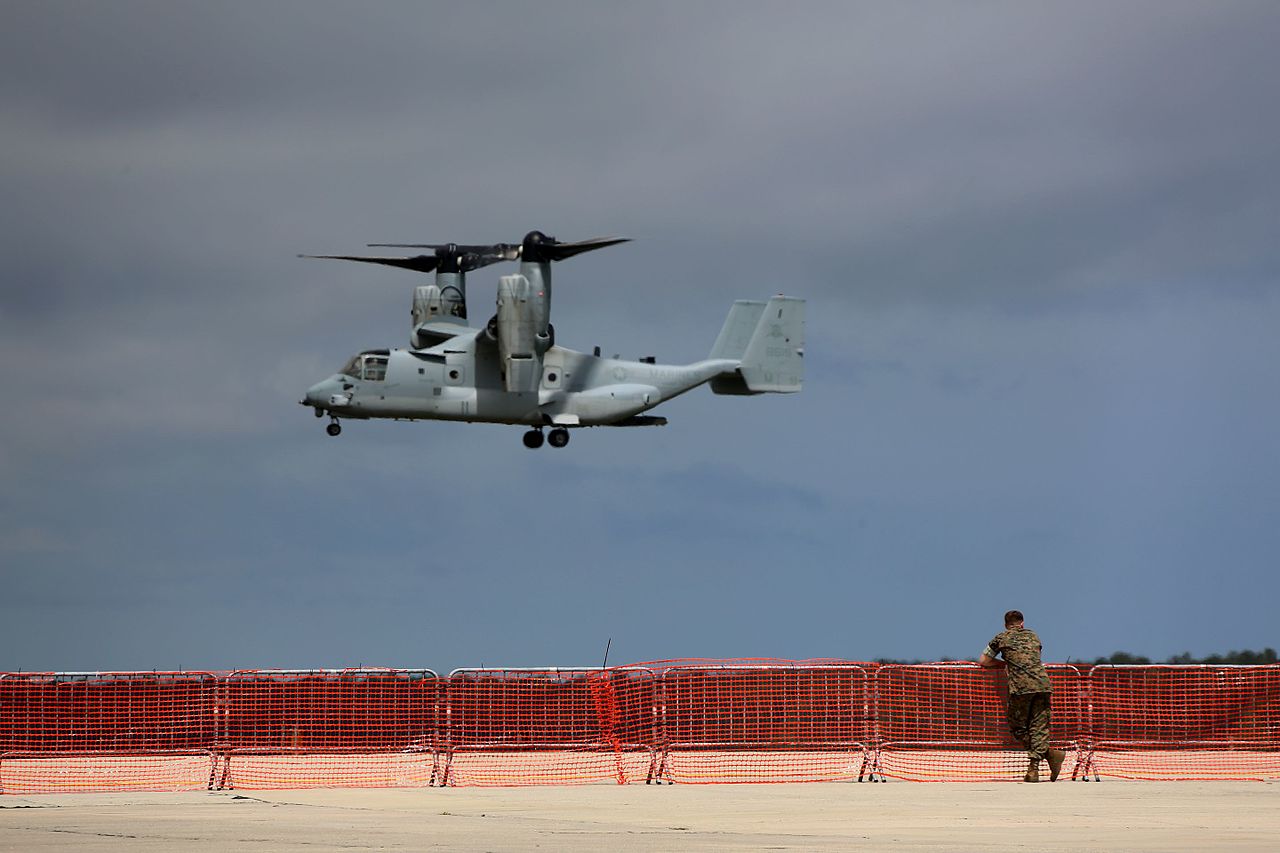 A V-22 Osprey tiltrotor helicopter in flight.