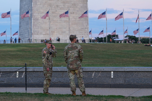 National Guard troops walk along the National Mall in Washington, D.C.