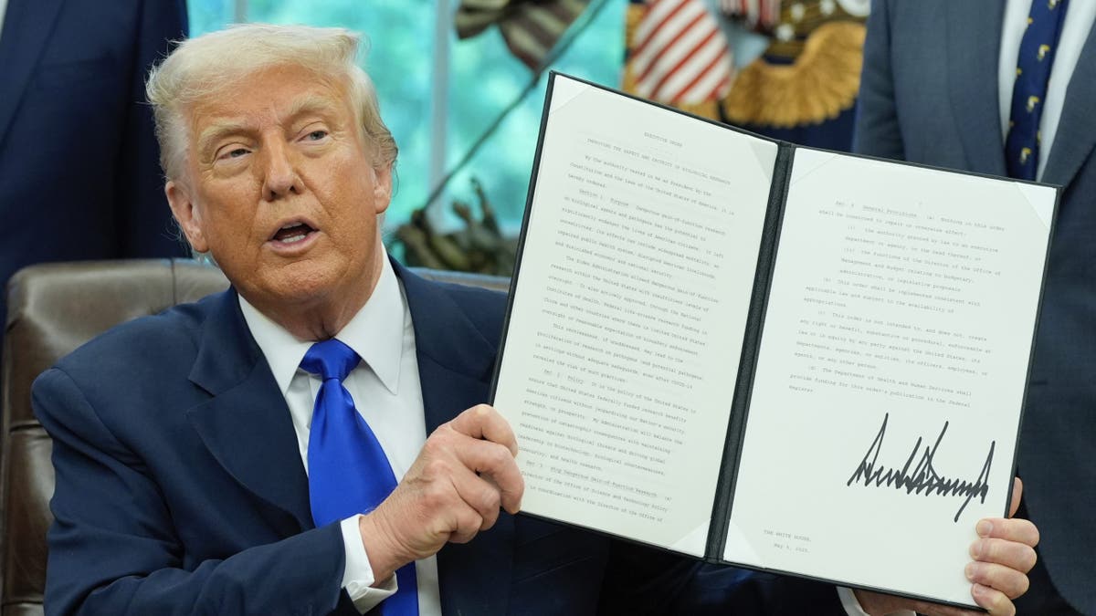 President Donald Trump holds an executive orders on biomedical research safety in the Oval Office of the White House, Monday, May 5, 2025, in Washington. (AP Photo/Alex Brandon)