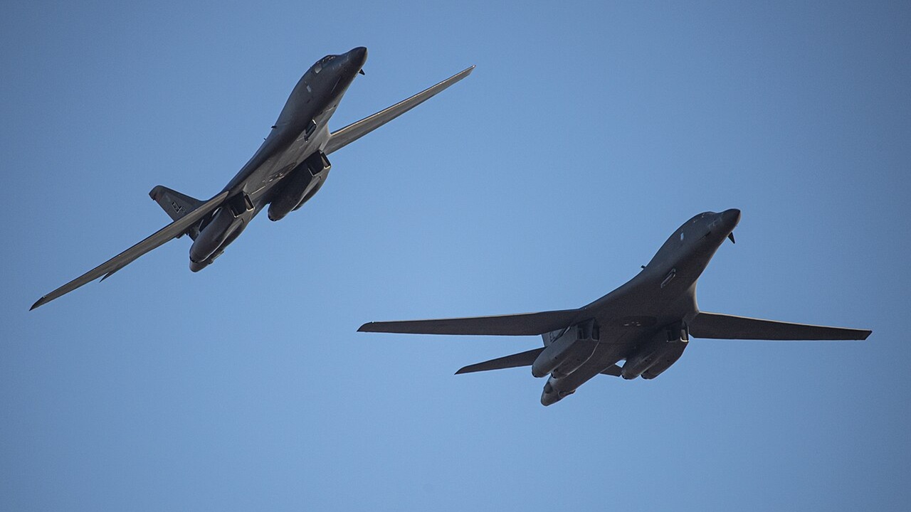Two B-1B Lancers in flight.
