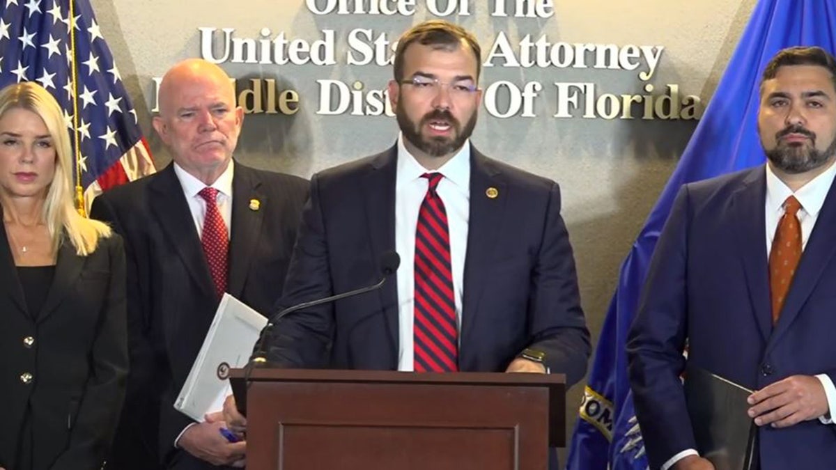 U.S. Attorney General Pam Bondi, left, listens as U.S. Attorney General of the Western District of Texas Justin Simmons speaks during a news conference Thursday, Sept. 4, 2025, in Tampa, Fla.