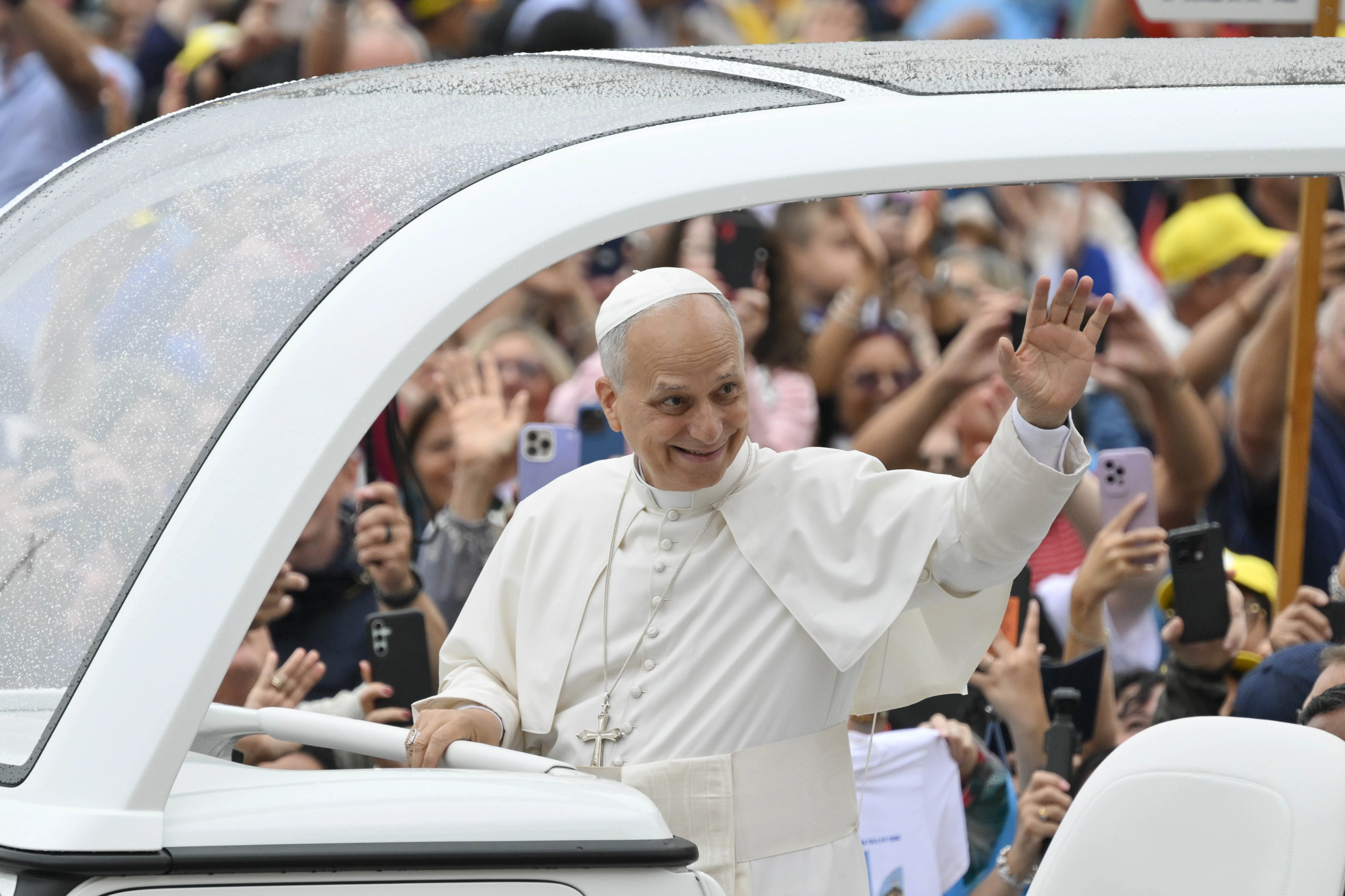 Pope Leo XIV waves at the crowds of people who braved a rainy morning for the general audience in St. Peter's Square on Sept. 10, 2025. Credit: Vatican Media