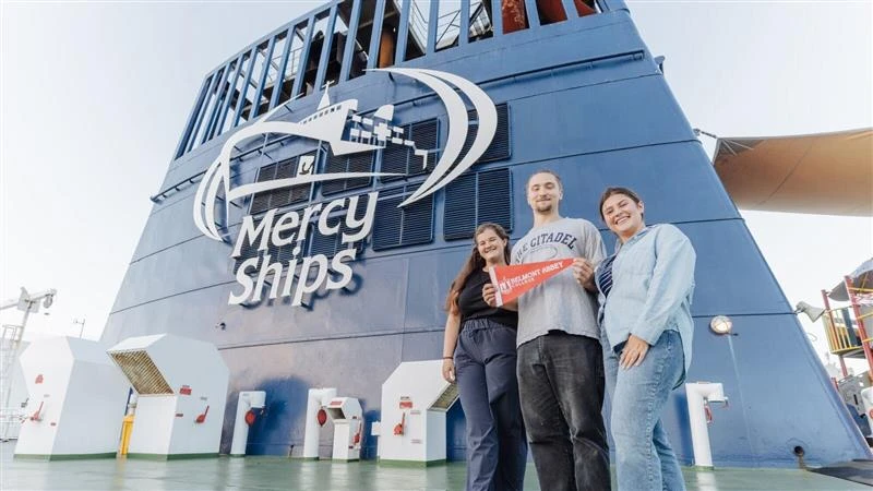 Nursing students Emma Harris, Eric Dike, and Caroline Gutierrez (left to right) represent Belmont Abbey College aboard “The Africa Ship” as part of a Christ-centered summer internship in 2025. Credit: Joshua Kiew Wing Chau