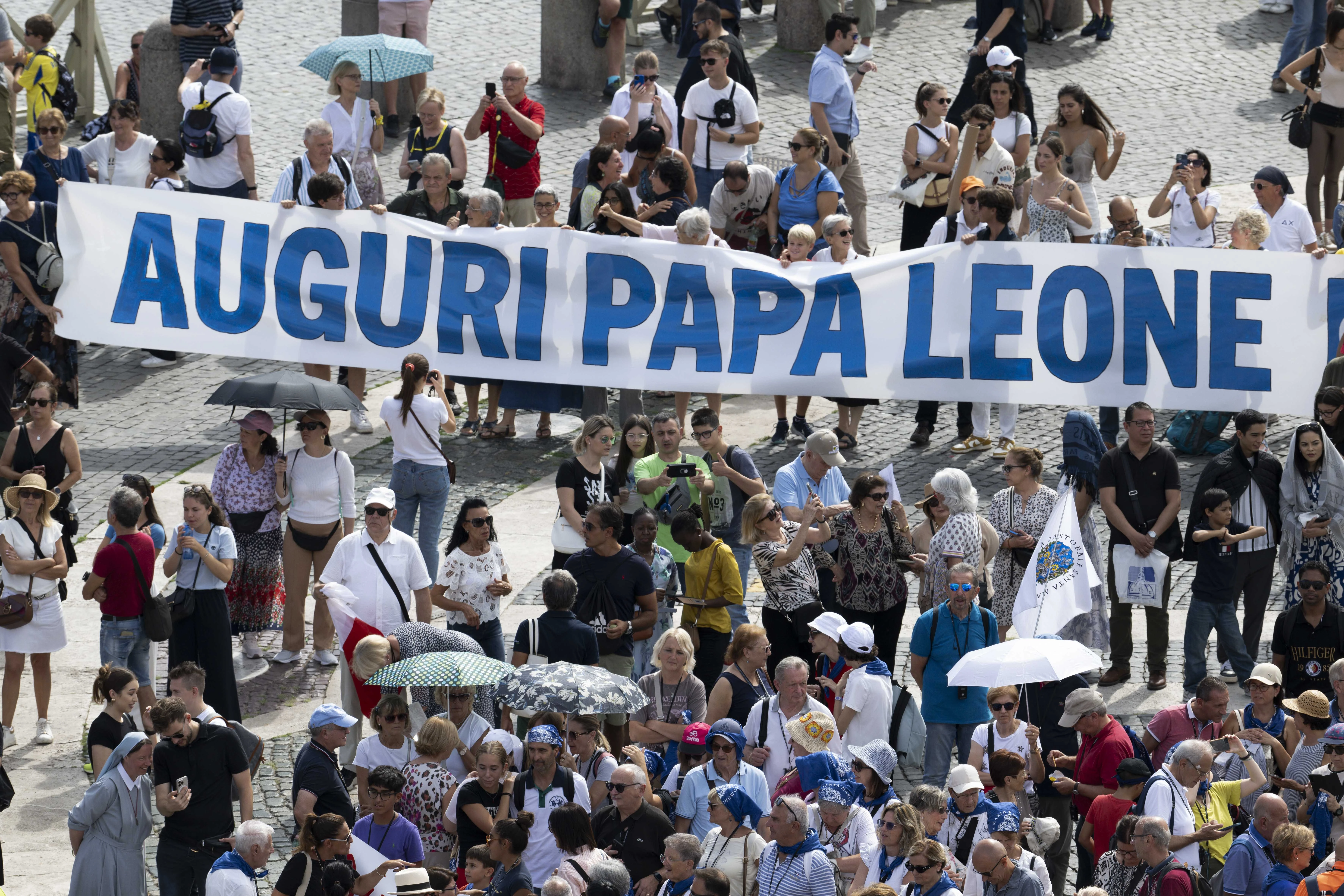 Pilgrims in St. Peter's Square hold a banner congratulating Pope Leo XIV on his 70th birthday, September 14, 2025. Vatican Media