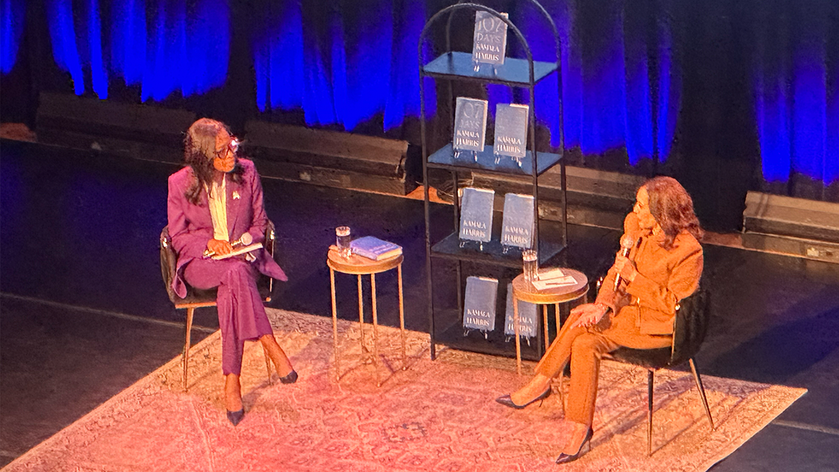 Kamala Harris on stage with Errin Haines