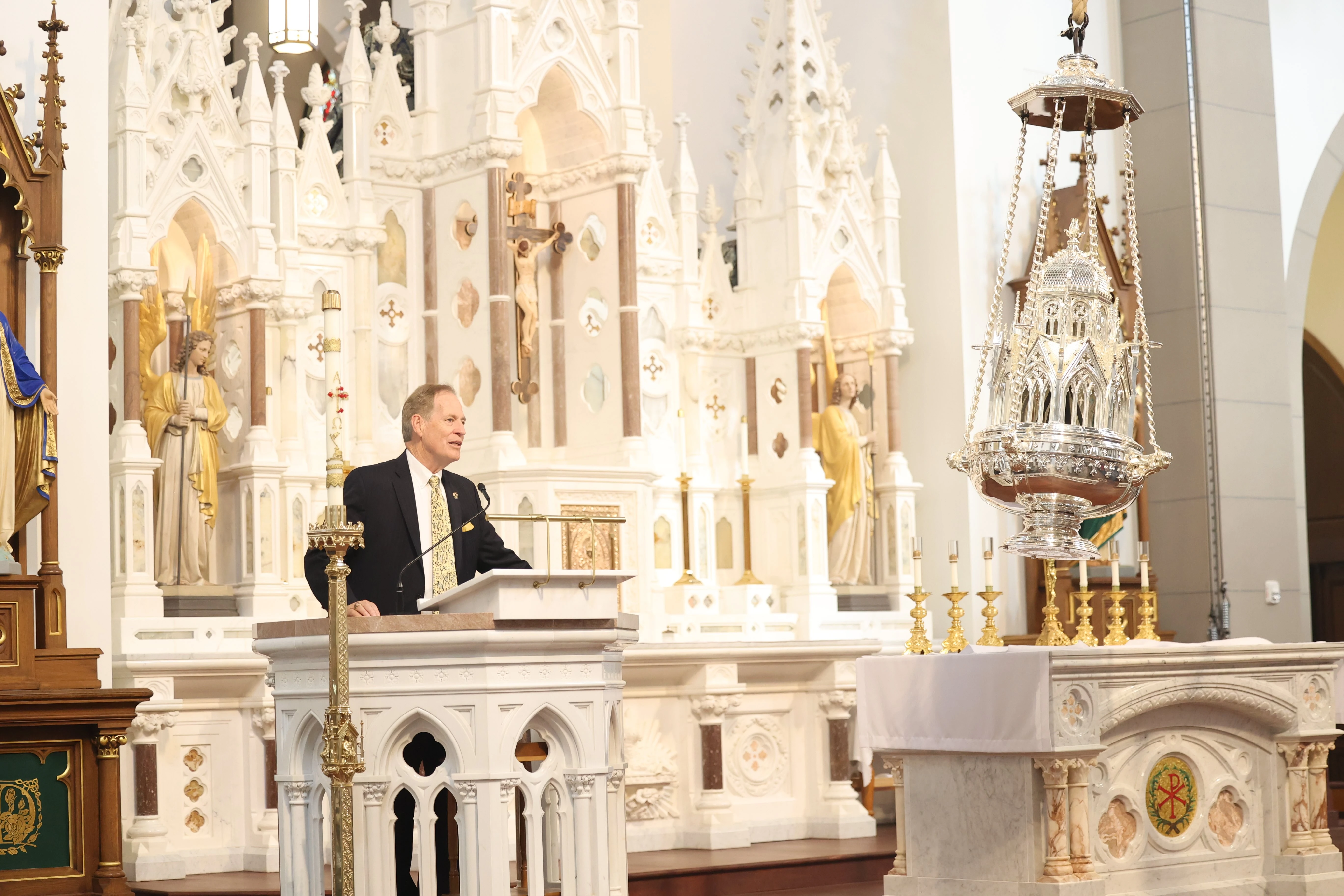 Seeing the giant thurible at the Cathedral of Santiago de Compostela gave Timothy O'Donnell, speaking here at the chapel, the idea to reproduce such a symbol of faith in the college's chapel. Credit: Photo courtesy of Christendom College