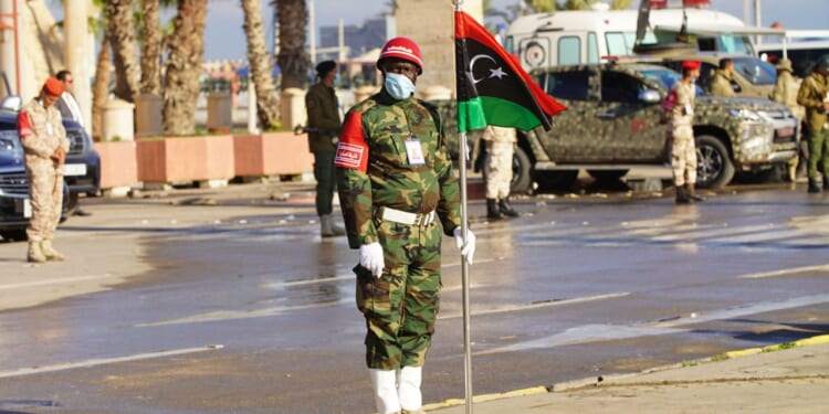 Libyan guard stands at attention in Tripoli, Libya.
