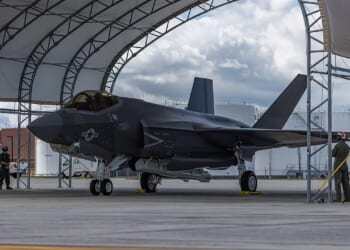 An F-35C fighter in a hangar.